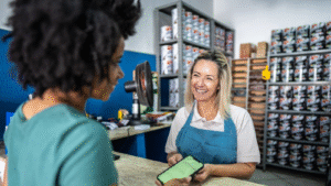 Toronto small business owner meeting with bookkeeper to review tax documents